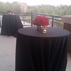 The balcony with cocktail tables for guest to mingle outdoors