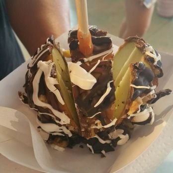 Bruce's Candy Kitchen - Rocky road candy apple, sliced for sharing. - Candy Stores Near Me - Cannon Beach, Oregon