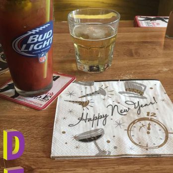 Landmark - a happy new year's eve with a drink and a note on a table - Bars Near Me - De Forest, Wisconsin
