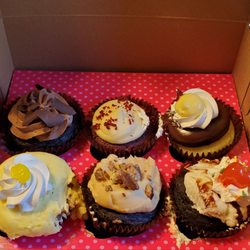 Smallcakes Cupcakery and Creamery - Lemon, boston cream, chocolate peanut butter, ice cream sundae and red velvet.