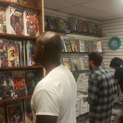 New customers and old checking out different comic racks.