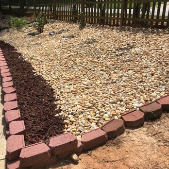 RHM Landscaping - a garden bed of gravel and rocks - Landscaping Near Me RHM Landscaping - a garden bed of gravel and rocks - Landscaping Near Me