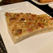 Photo of BLT Steak - Las Vegas, NV, United States. Cheese bread with bacon bits.