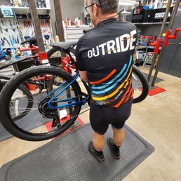 Bikeshop owner making sure the brakes are perfect. Bikeshop owner making sure the brakes are perfect.