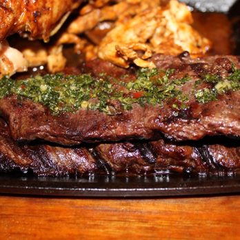 Pollos & Jarras - a plate of meat and vegetables - Peruvian Near Me - Miami, Florida Pollos & Jarras - a plate of meat and vegetables - Peruvian Near Me - Miami, Florida