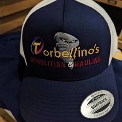 Shaddai - Embroidered hats and screen printed shirts