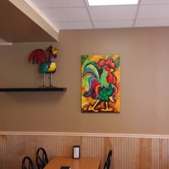 El Pollo Dorado - a table and chairs in a restaurant - Mexican Near Me - Roswell, Georgia