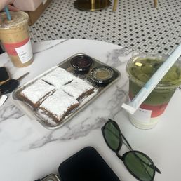 Matcha latte iced and Beignets (4) with cheesecake and blueberry syrup