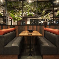 Alter Brewing + Kitchen - Comfy booth seating.