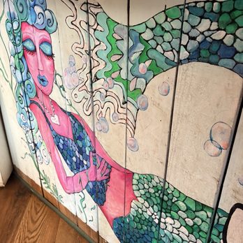 Cafe Koa - Mermaid painting on the bar front. - Cafes Near Me - Southport, North Carolina