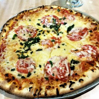 Central Market Cafe - Their classic cheese pizza. - American Near Me - Austin, Texas
