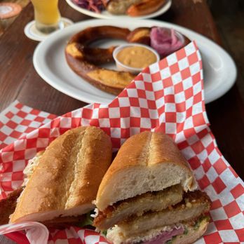 Your Mom's Haus - Schnitzel sandwich (awesome!!), soft pretzel with beer cheese and bratwurst with coleslaw and potato salad sides. - Pubs Near Me - El Granada, California Your Mom's Haus - Schnitzel sandwich (awesome!!), soft pretzel with beer cheese and bratwurst with coleslaw and potato salad sides. - Pubs Near Me - El Granada, California