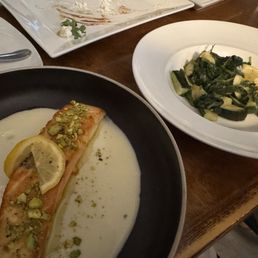 Pistachio crusted salmon and side of veggies.