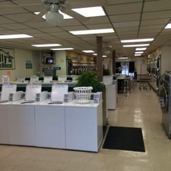Dolly's Wash House - Dolly's definitely has plenty of washers and dryer's. Two TVs as well.