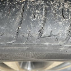Budget - Passenger front tire cut near end of tread - REPLACE