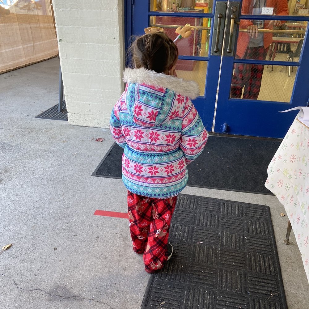 The child running to the door. Always excited to go to school.