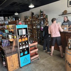 Roadrunner Spirits - Cool displays, customers making a purchase