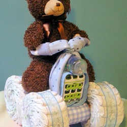 JeannieBean - 4 wheeler diaper cake with 56 diapers, 2 receiving blankets and much more. Prices start at $55.