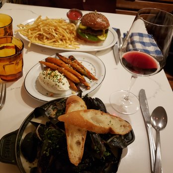 Poulet Bleu - Mussels, carrots, burger with french fries. Bordeaux wine - French Near Me - Pittsburgh, Pennsylvania Poulet Bleu - Mussels, carrots, burger with french fries. Bordeaux wine - French Near Me - Pittsburgh, Pennsylvania