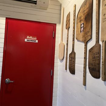 Andrew Bellucci's Pizzeria - a red door in a hallway - Pizza Near Me - Astoria, New York Andrew Bellucci's Pizzeria - a red door in a hallway - Pizza Near Me - Astoria, New York