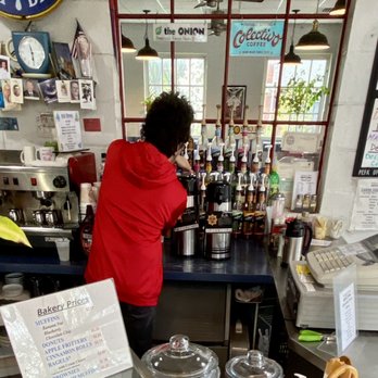 Sherman Perk Coffee Shop - a woman standing at the counter - Coffee & Tea Near Me - Milwaukee, Wisconsin Sherman Perk Coffee Shop - a woman standing at the counter - Coffee & Tea Near Me - Milwaukee, Wisconsin