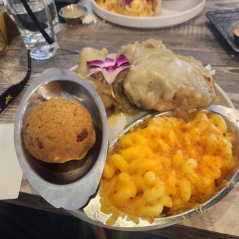 Sweet T's Southern Eatery - Smothered chicken with a side of stuffing and mac and cheese. - Soul Food Near Me - Montclair, New Jersey