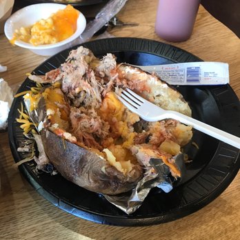 BBQ 65 - What's left of my loaded potato with Pork - Barbeque Near Me - Greenville, Alabama BBQ 65 - What's left of my loaded potato with Pork - Barbeque Near Me - Greenville, Alabama