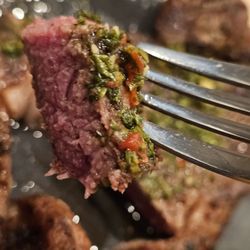 Inka Grill - Close-up of a fork holding a piece of the steak.