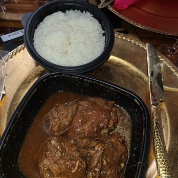 IQ Bar And Grill - Brown stew chicken.  It took so long,  I asked for it to be boxed up. - Caribbean Near Me - Milford Mill, Maryland
