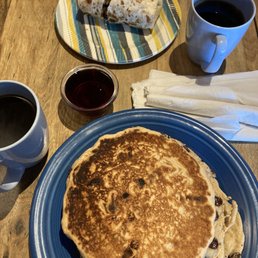 2 chocolate chip pancakes, vegan burrito and coffee.