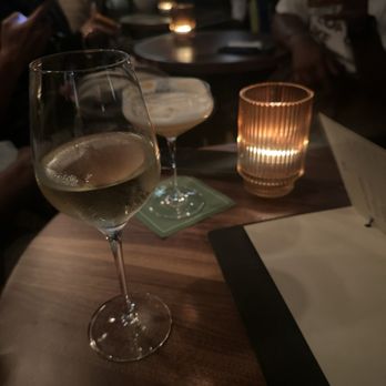 Ginger's - a glass of wine on a table - Cocktail Bars Near Me - Dallas, Texas