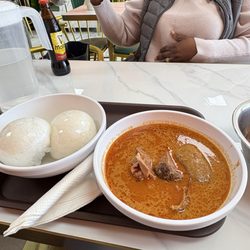 Rahama Restaurant & Catering - Light soup with goat meat and rice balls