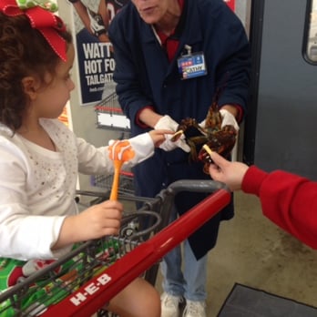 H-E-B - Ladies at the Seafood department make my daughter's day and let her have a up-close visit with a lobster! Awesome! - Grocery Near Me - Cypress, Texas