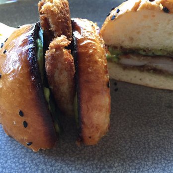 Moku Kitchen - Upcountry Fire: Fried chicken sandwich (pre-cut by Moku kitchen) - Cocktail Bars Near Me - Honolulu, Hawaii Moku Kitchen - Upcountry Fire: Fried chicken sandwich (pre-cut by Moku kitchen) - Cocktail Bars Near Me - Honolulu, Hawaii