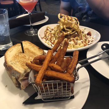 110 Grill - Henrietta - In front: Cuban sandwich Behind: pulled pork Mac and cheese - New American Near Me - Henrietta, New York 110 Grill - Henrietta - In front: Cuban sandwich Behind: pulled pork Mac and cheese - New American Near Me - Henrietta, New York