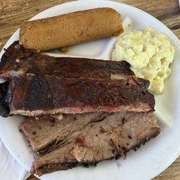 Rib and brisket combo with tater salad and a tamale.