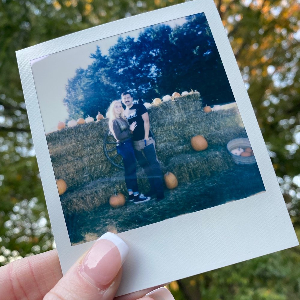 Buckeye Acres - a woman and her dog in a pumpkin patch - Pick Your Own Farms Near Me - Warrensburg, Missouri