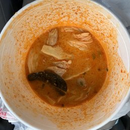 a bowl of soup in a plastic container