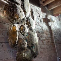 Ochos Cocktail & Wine Bar - Next to the stairs was beautiful wall decor over old brick with stunning natural light.