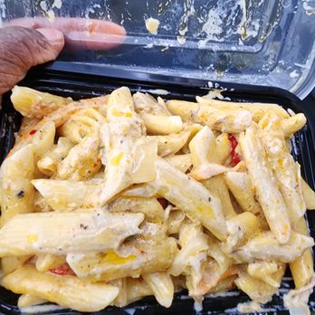 Awesome Sauce Carribean - a hand holding a container of pasta - Caribbean Near Me - Bridgeport, Connecticut