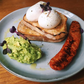 Seven Seeds - Poached eggs on toast, with smashed avocado and chorizo added - the perfect combination. - Coffee & Tea Near Me - Carlton, VIC Seven Seeds - Poached eggs on toast, with smashed avocado and chorizo added - the perfect combination. - Coffee & Tea Near Me - Carlton, VIC