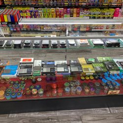 Dab City Tobacco and Vape - One of the show cases that shows our Grinders and Scales