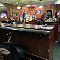 Sunny's Sunset Supper Club - Bar area. Sunny is bartending.