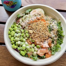 Build your own bowl with spicy tuna and spicy salmon over kale