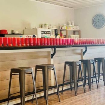 Cameron Nutrition - a row of red cups lined up on a bar - Juice Bars & Smoothies Near Me - Cameron, Missouri Cameron Nutrition - a row of red cups lined up on a bar - Juice Bars & Smoothies Near Me - Cameron, Missouri