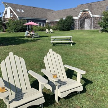 Rossignol Winery - Outdoor seating area. Wine store in the background - Wineries Near Me - Murray River, Prince Edward Island Rossignol Winery - Outdoor seating area. Wine store in the background - Wineries Near Me - Murray River, Prince Edward Island