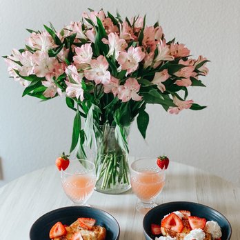 Trader Joe's - Trader Joe's flowers, brioche bread, whipped cream, strawberries, & peach bellini - Grocery Near Me - Austin, Texas