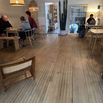 Harless + Hugh - people sitting at tables in a restaurant - Coffee & Tea Near Me - Bay City, Michigan