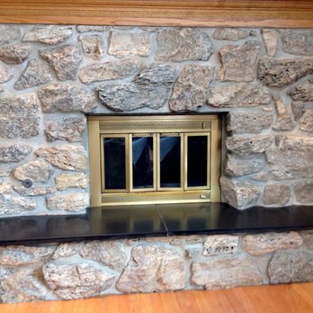 Fireplace Transfusion - Unsightly dark stones were painted to brighten and add harmony to the fireplace. - Painters Near Me Fireplace Transfusion - Unsightly dark stones were painted to brighten and add harmony to the fireplace. - Painters Near Me