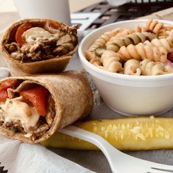 Capra's Italian Deli - Grilled chicken and pesto wrap with a side of pasta salad. Delicious!!